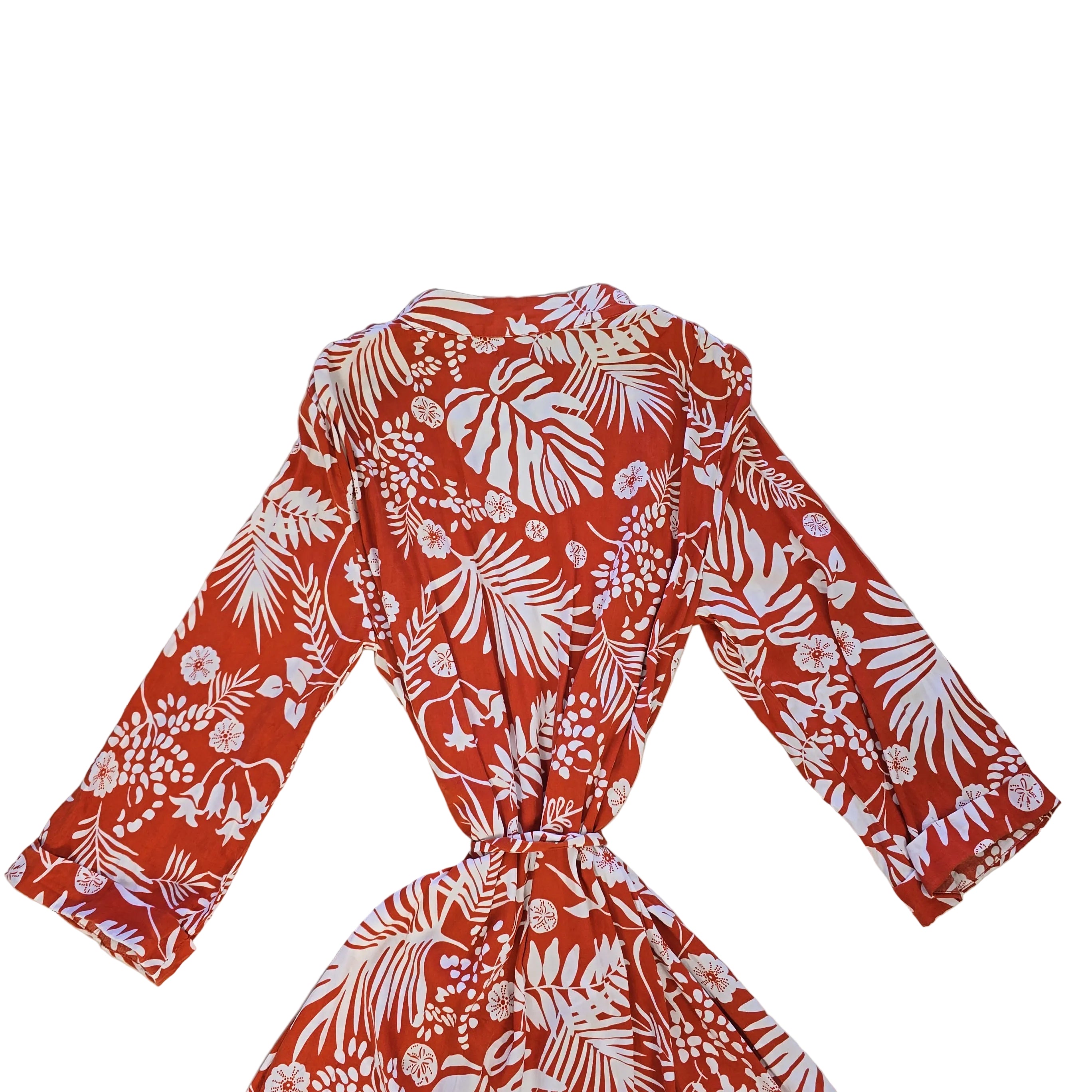Orange and white palm patterned robe on a light background