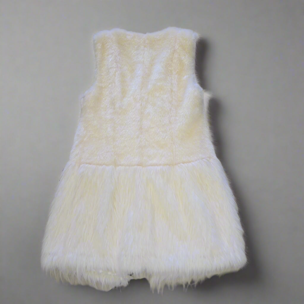 White fluffy Vest on a tiled floor