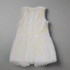 White fluffy Vest on a tiled floor