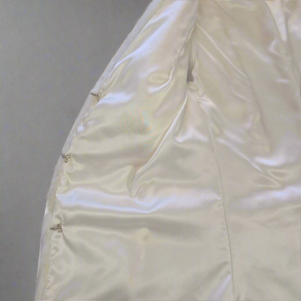 White quilt on a tiled floor