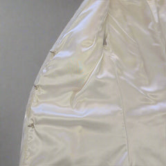 White quilt on a tiled floor