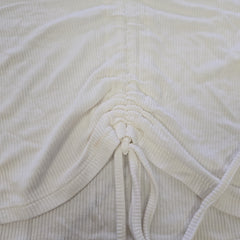 Close-up of a textured fabric with a drawstring.