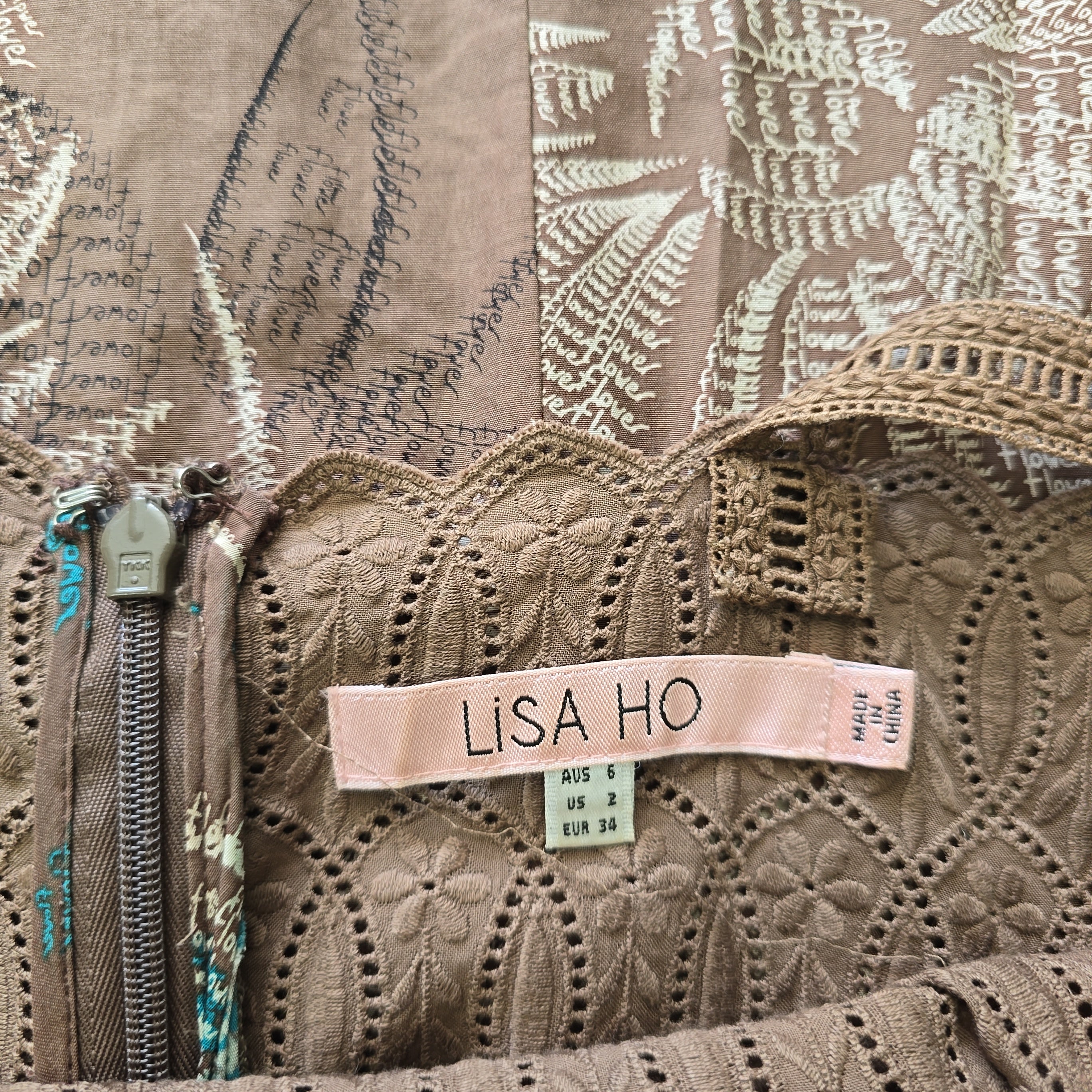 Close-up of a textured fabric with a 'Lisa Ho' label.