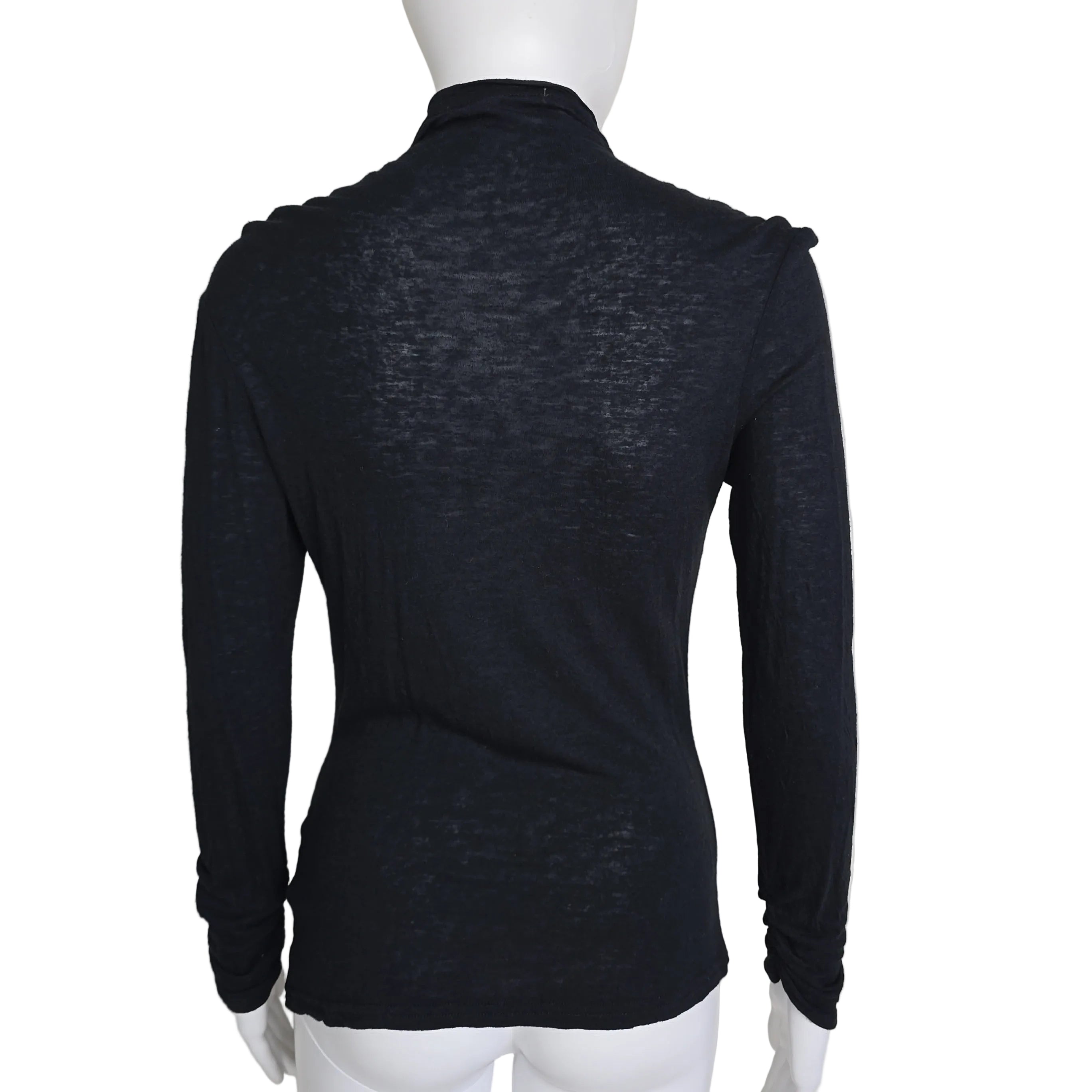 Black top with long sleeves on a light background