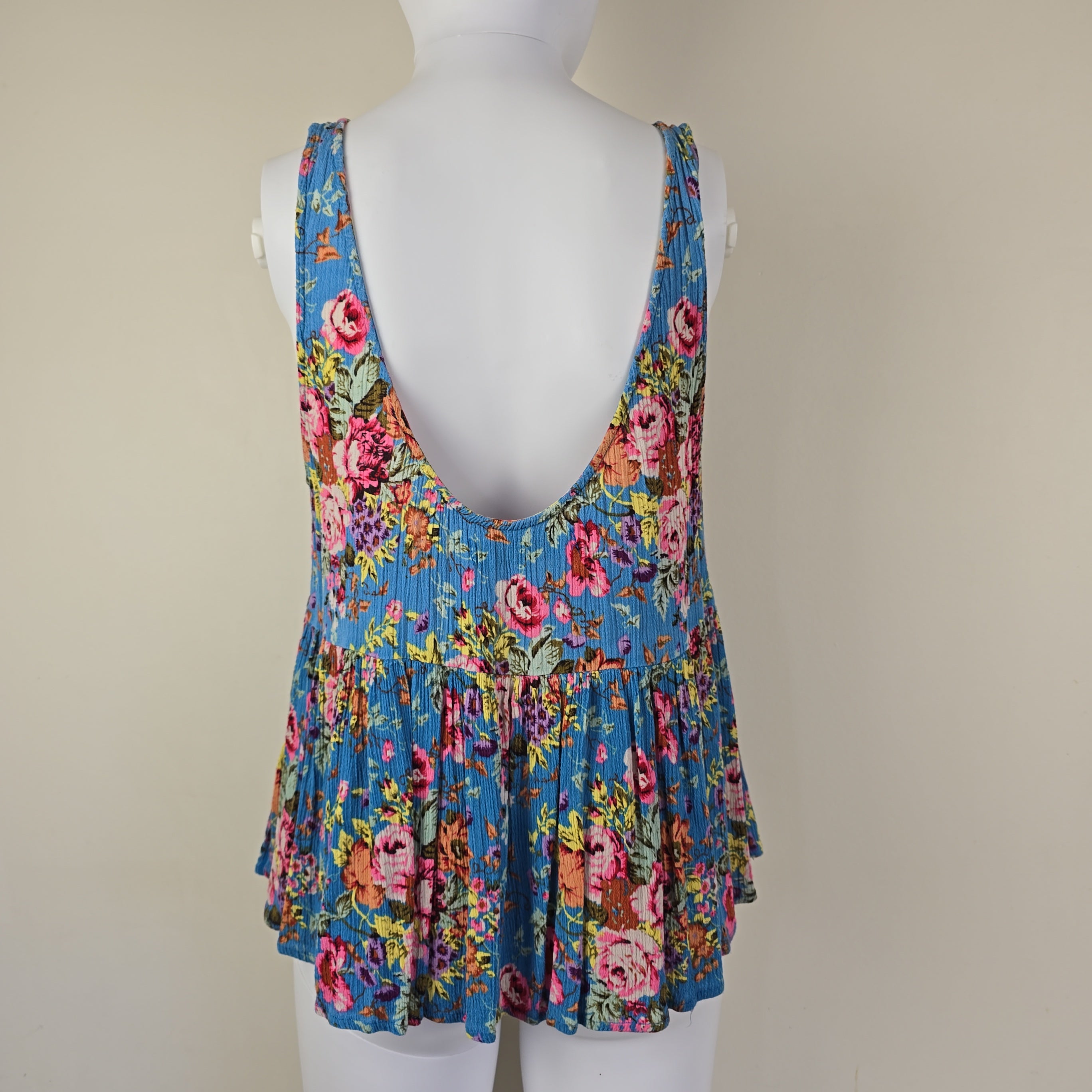 Blue floral top with on a light background