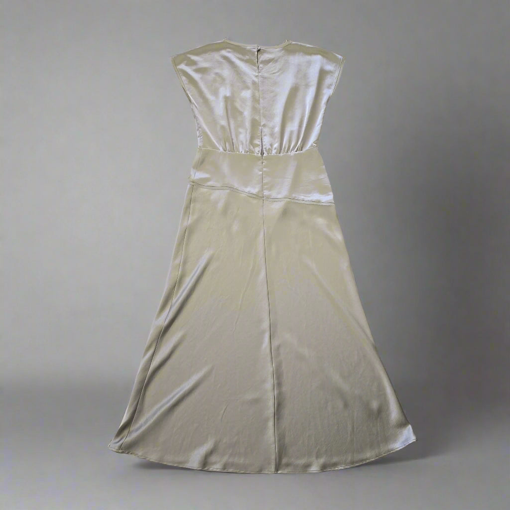 Olive strapless dress on a tiled floor