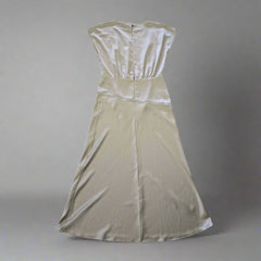 Olive strapless dress on a tiled floor