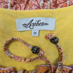 Orange patterned dress on a light background