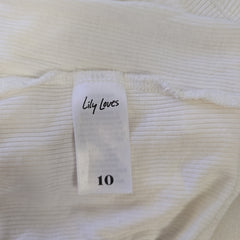 Close-up of a white garment with a label reading 'Lily Loves' and size '10'.