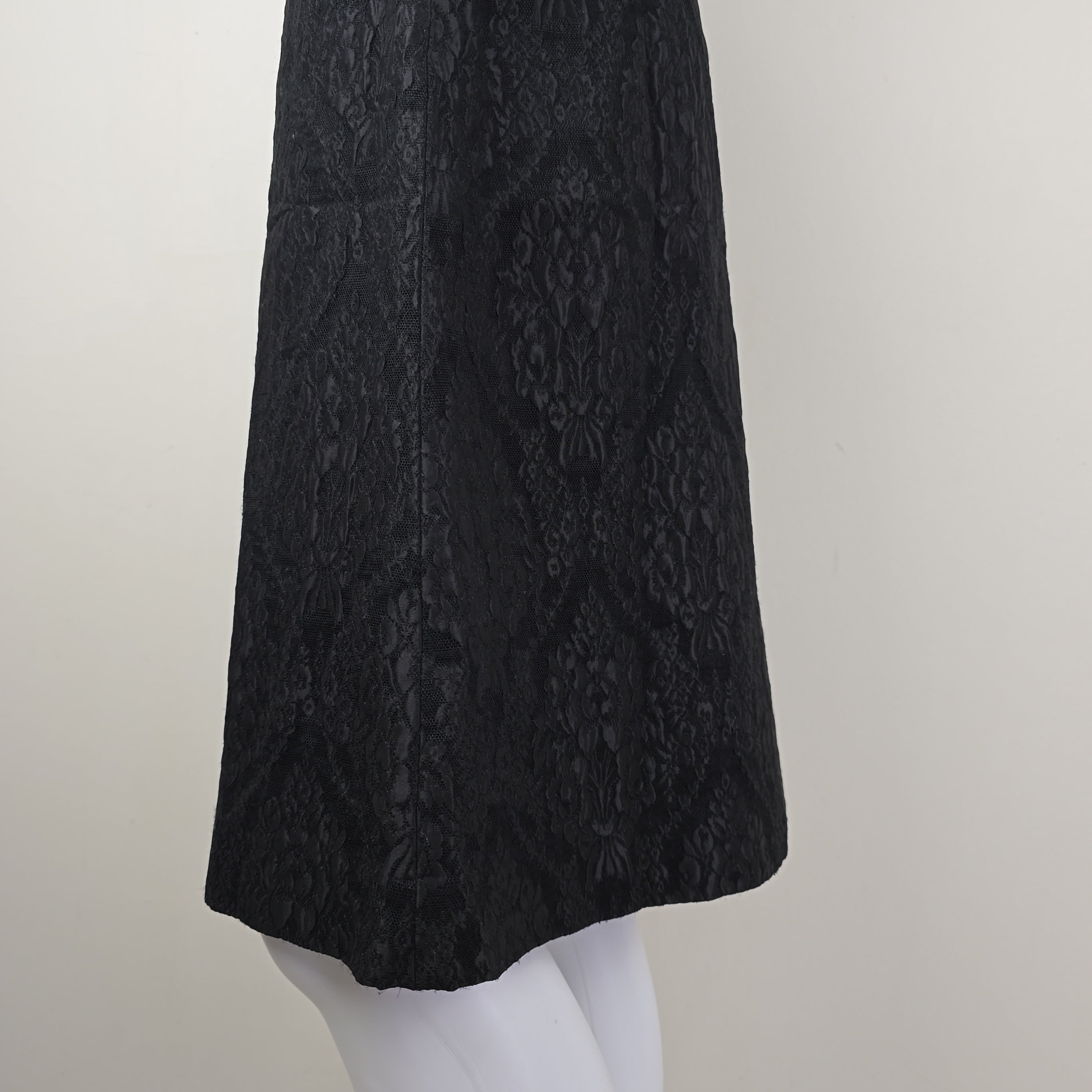 Black textured skirt on a white background