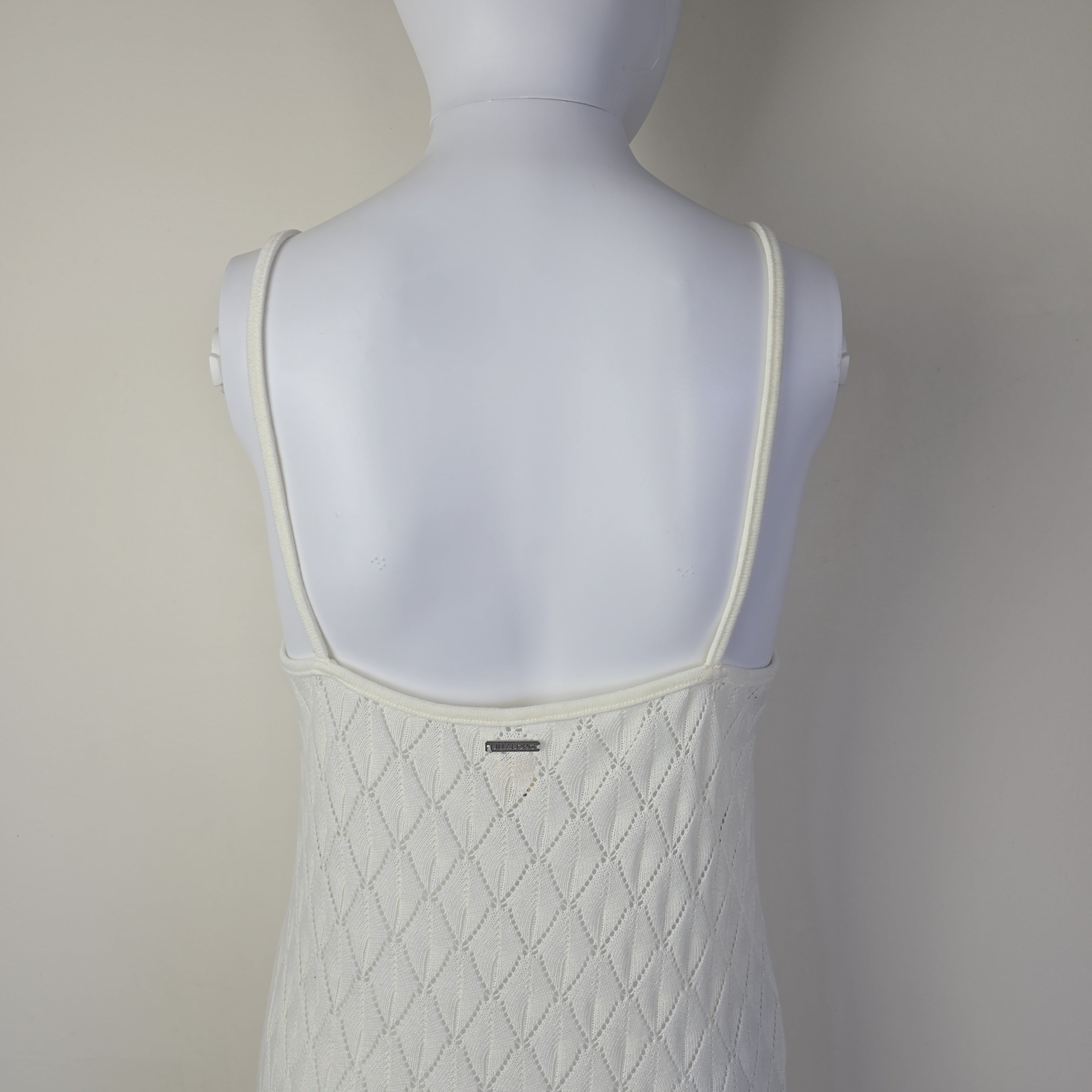 White textured dress on a light background.