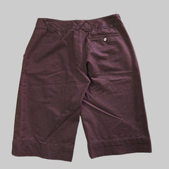 Purple pants on a tiled floor