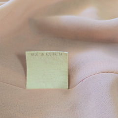 Close-up of a label on a pink garment with 'Made in Australia' text.