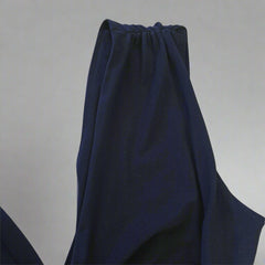 Navy blue dress on a light gray background