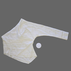 White textured garment on a tiled floor