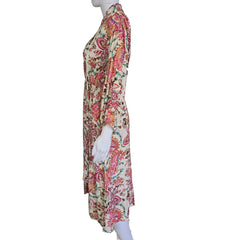 Floral patterned wrap style dress on a light background