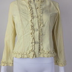 Light yellow jacket with frill details on a light background