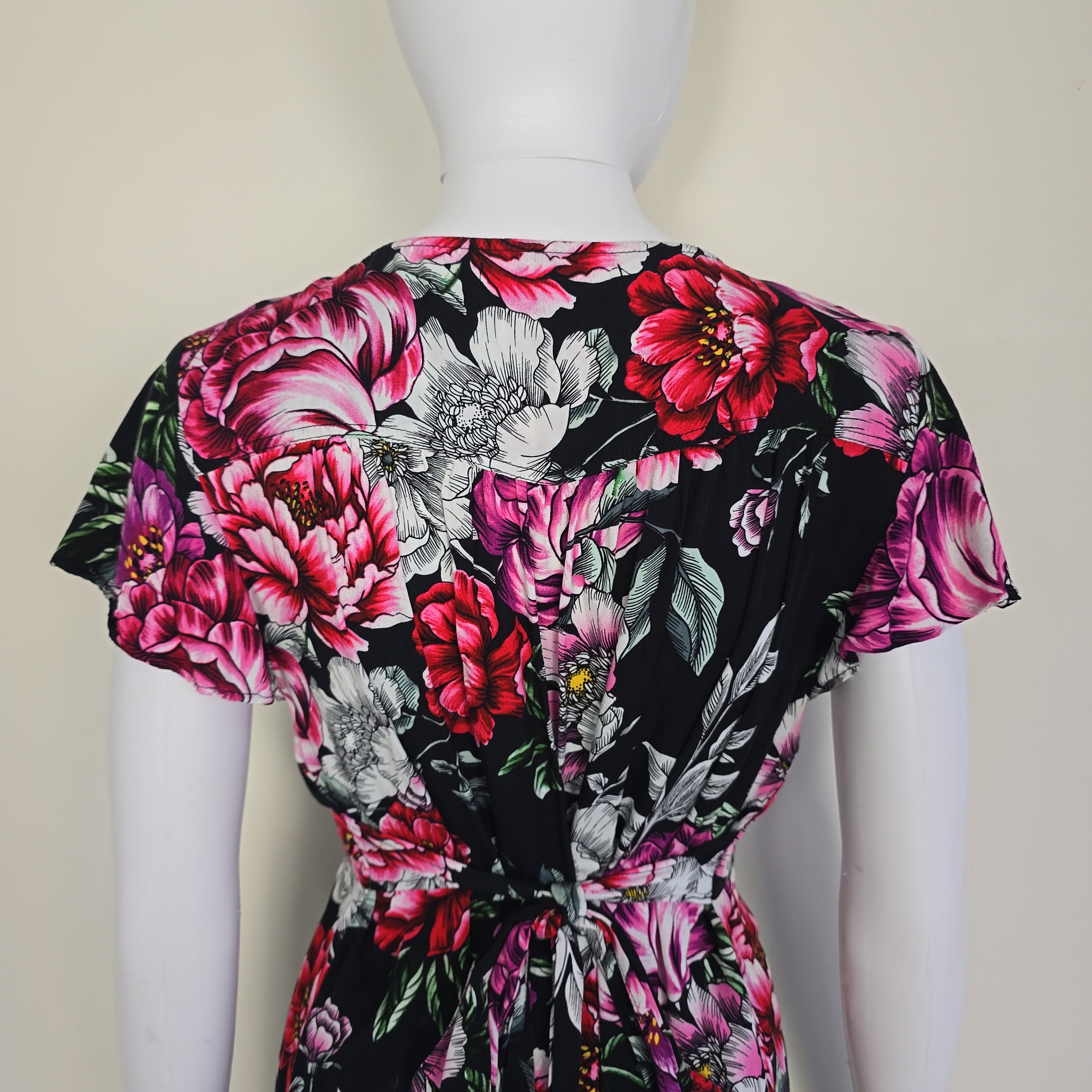 Floral dress with pink and black colors on a white background