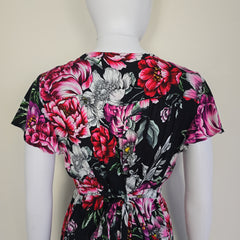 Floral dress with pink and black colors on a white background