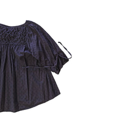 Brown long-sleeve top on a light background