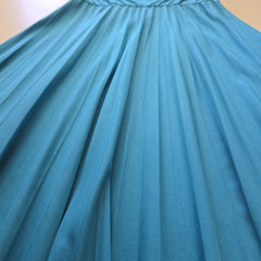 Close-up of a pleated turquoise fabric