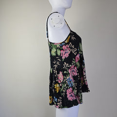 Black floral-patterned top on a light background