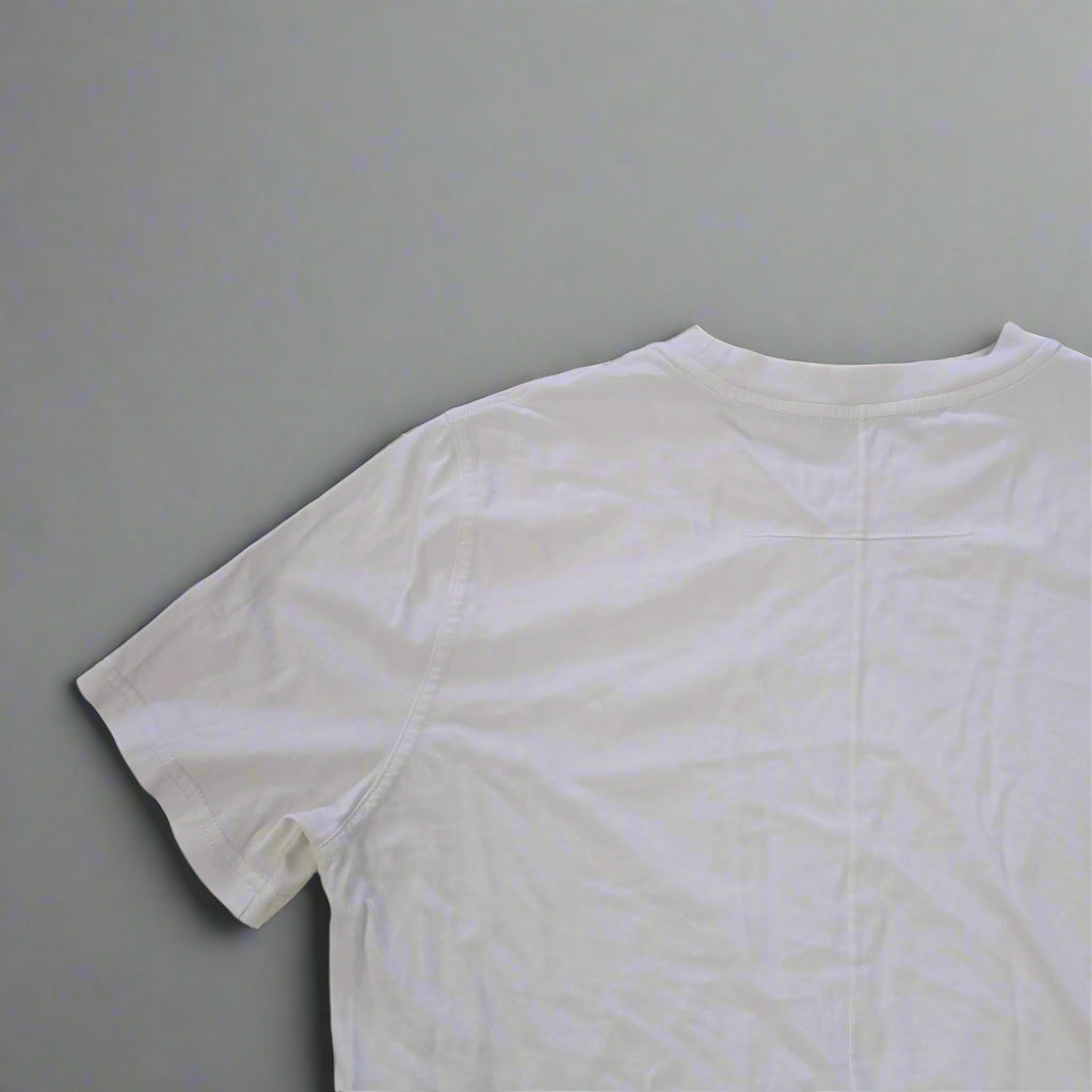 White t-shirt on a tiled floor