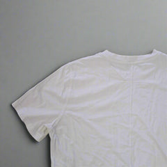 White t-shirt on a tiled floor