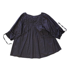 Brown long-sleeve top on a light background