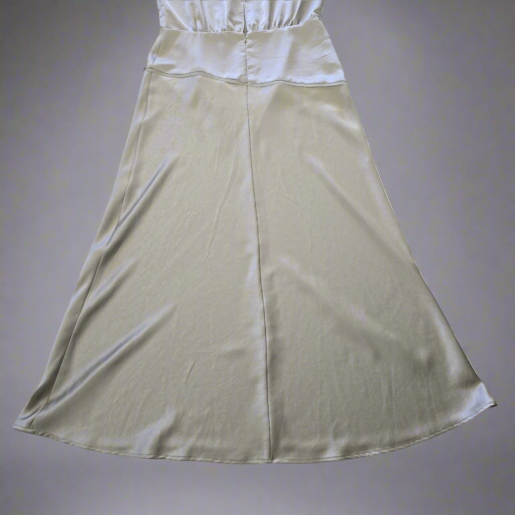 Light green dress on a tiled floor