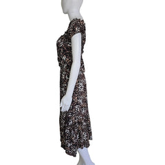 Mannequin wearing a leopard print dress against a plain background