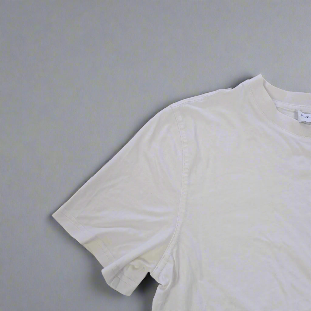 White tank top on a tiled floor
