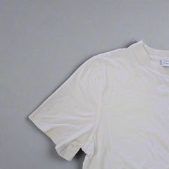 White tank top on a tiled floor