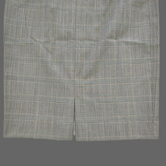 Gray checkered skirt on a tiled floor