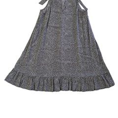 Black and white patterned dress on a tiled floor