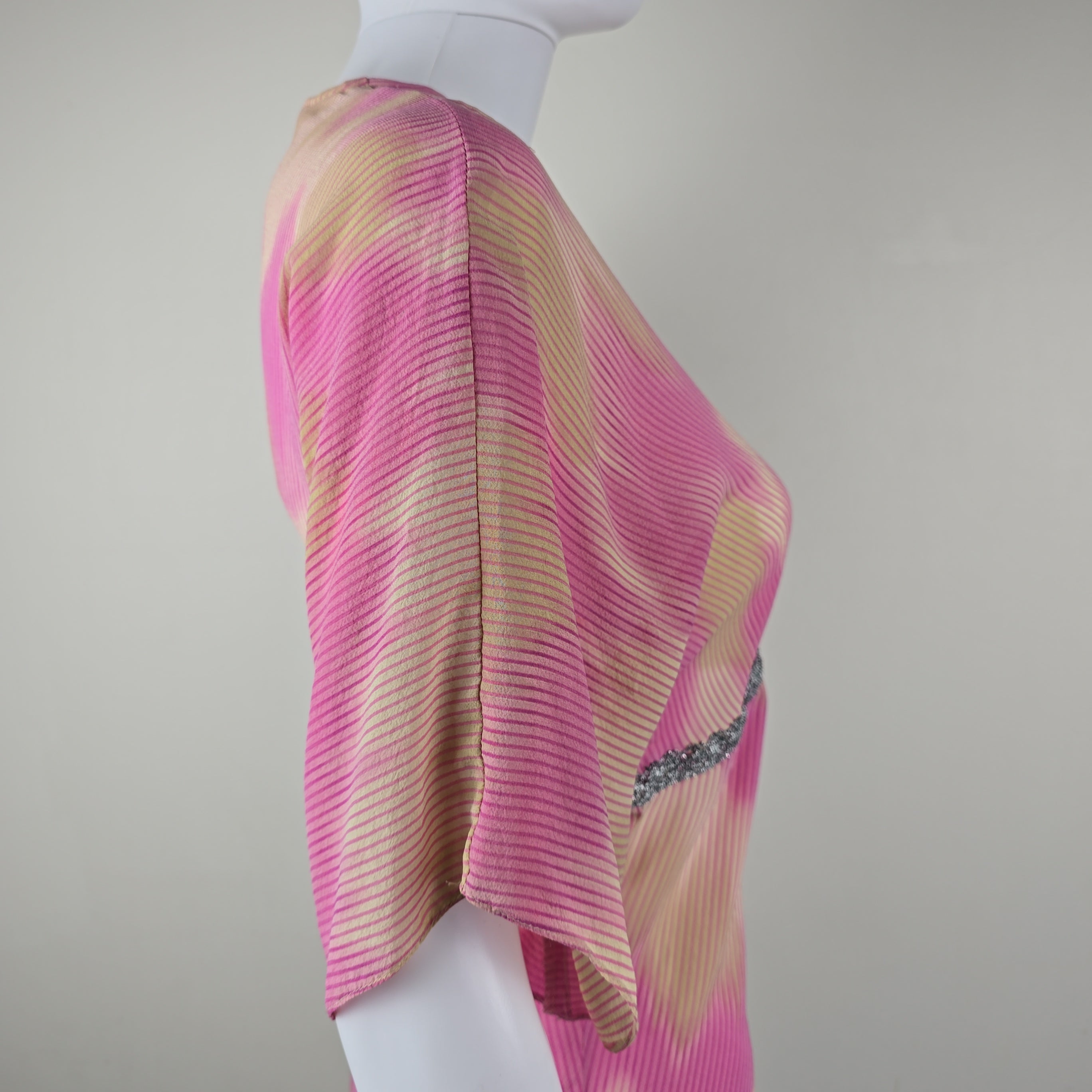 Pink and beige striped top on a white background