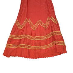 Orange dress with yellow lace embroidery on a light background