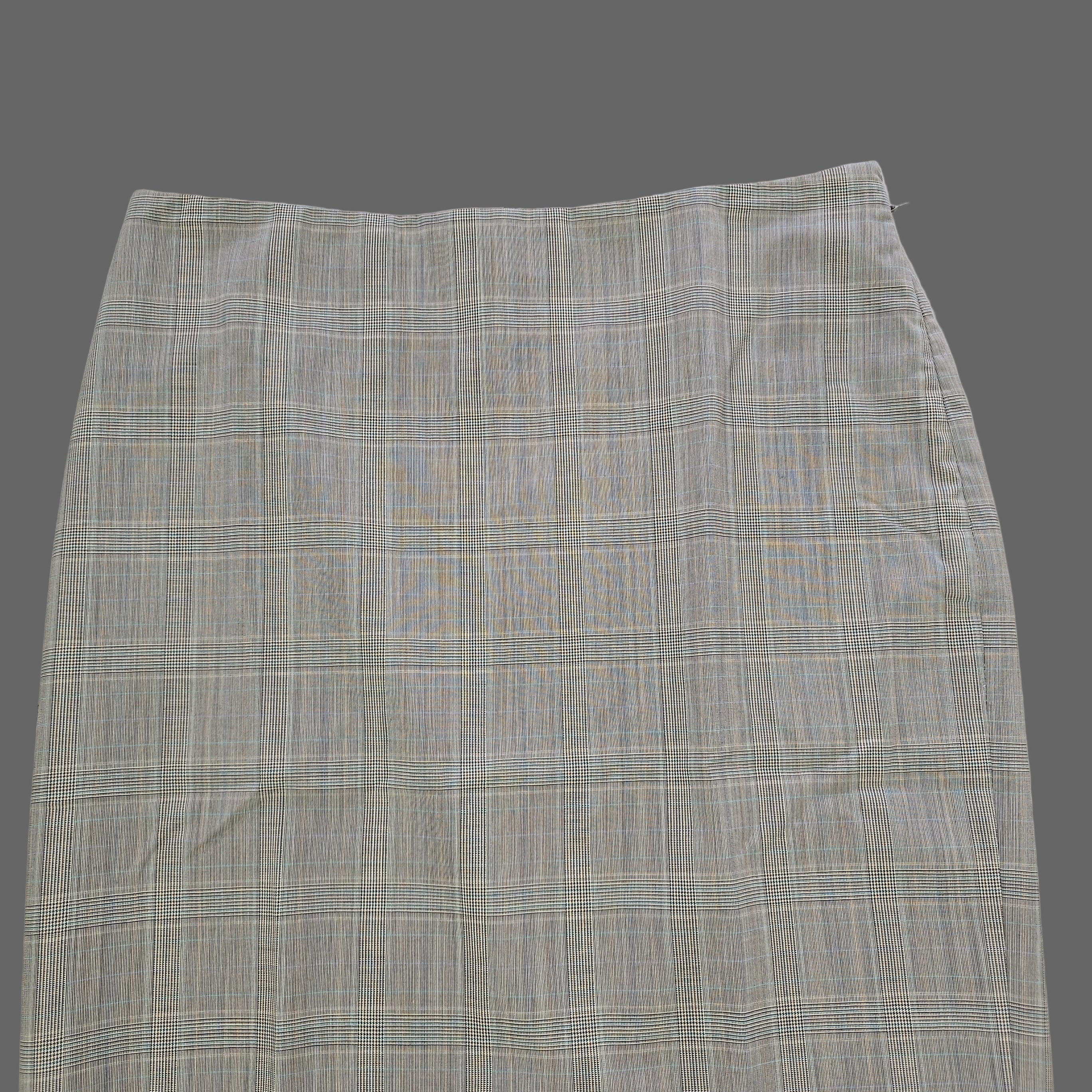 Plaid skirt on a tiled floor