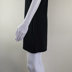 Black skirt on a white mannequin arm against a plain background