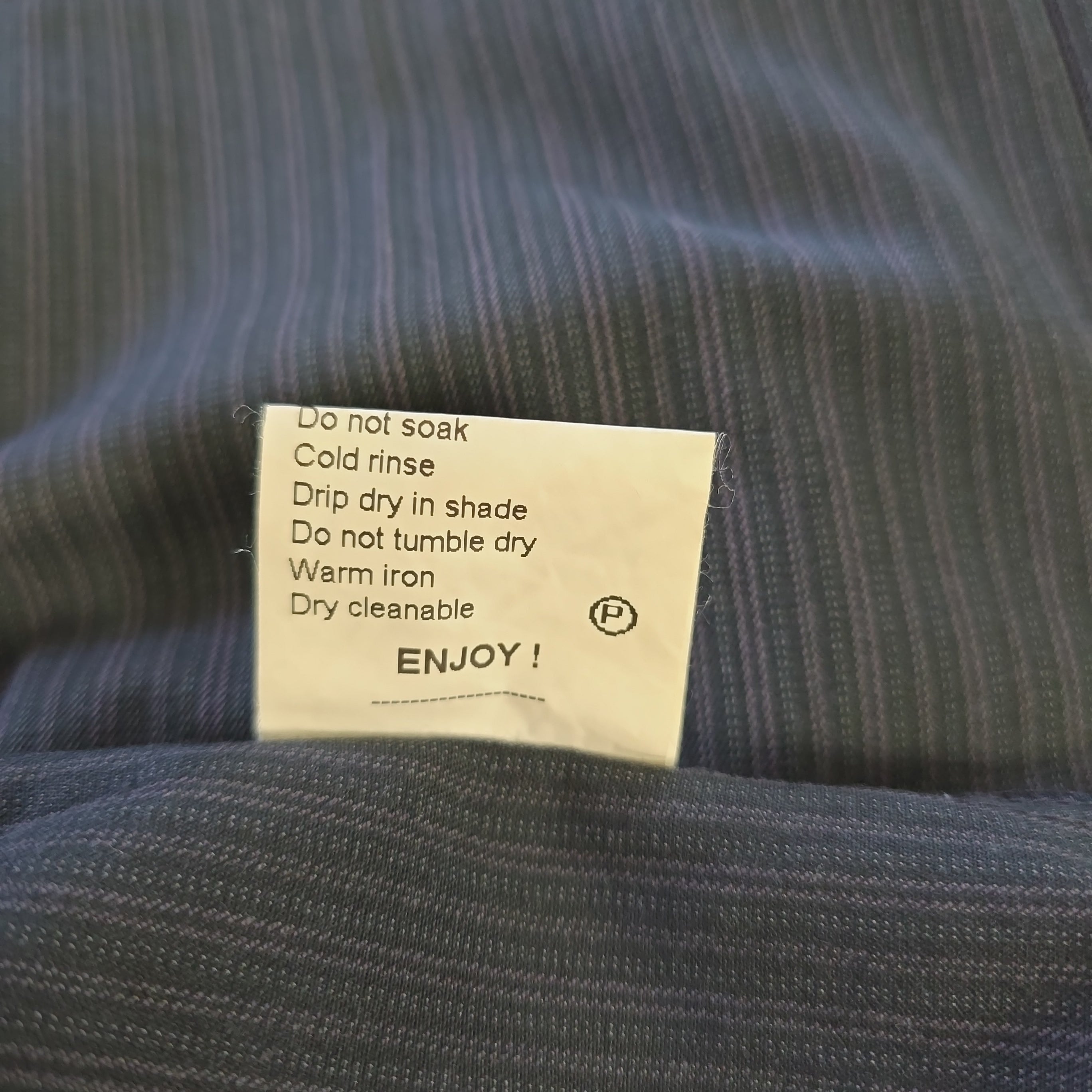 Clothing label on a textured fabric background