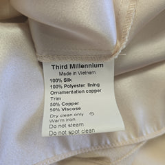 Fabric tag with material details on a beige fabric background