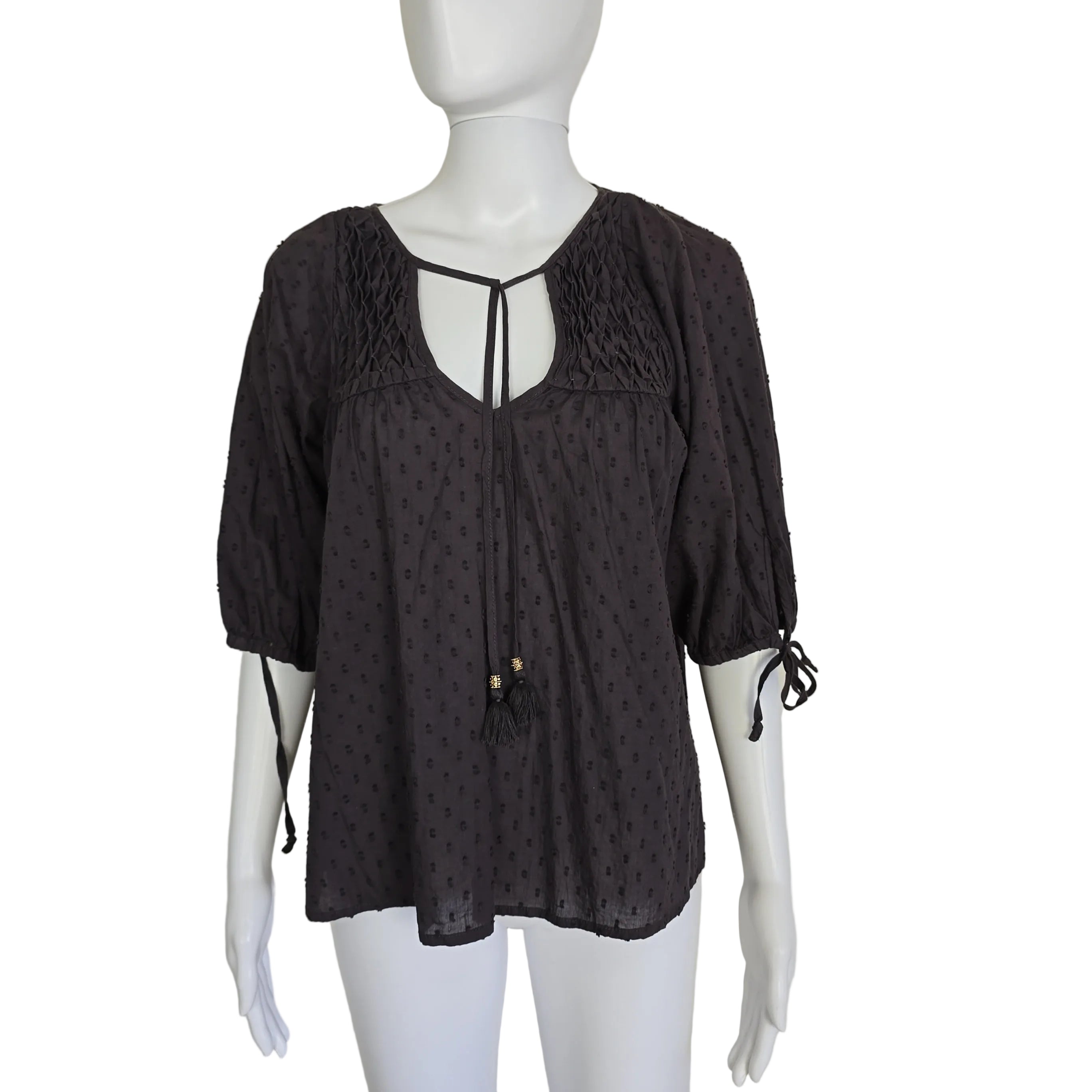 Brown long-sleeve top on a light background