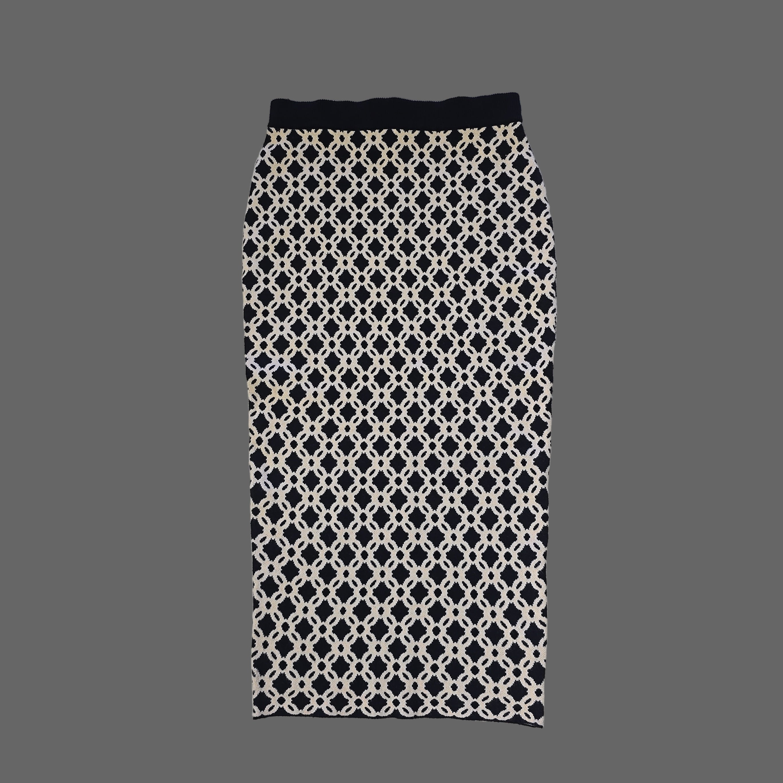 Black and white patterned skirt on a tiled floor