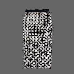 Black and white patterned skirt on a tiled floor