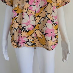 Floral dress on a mannequin with a neutral background