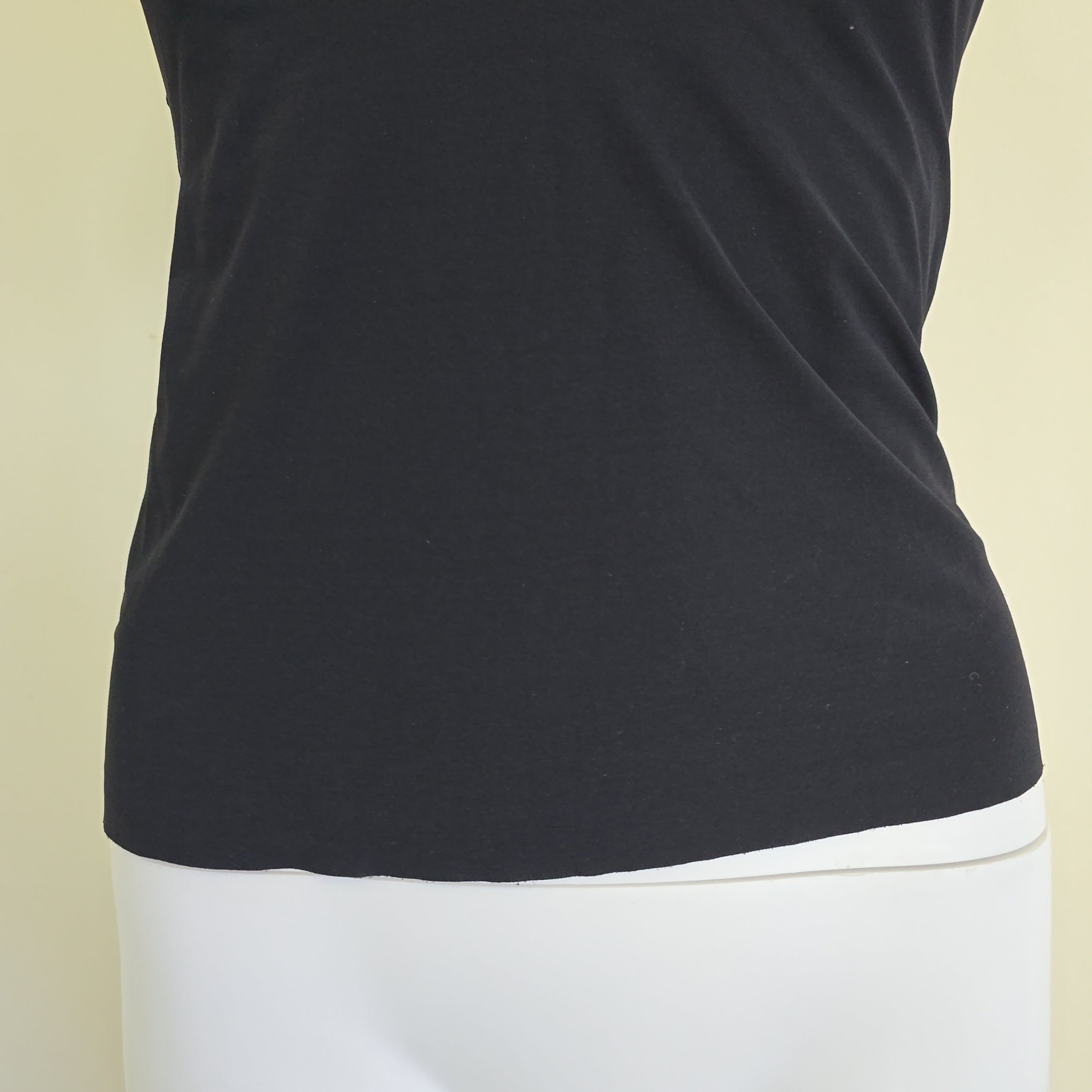 Black tank top on a light background
