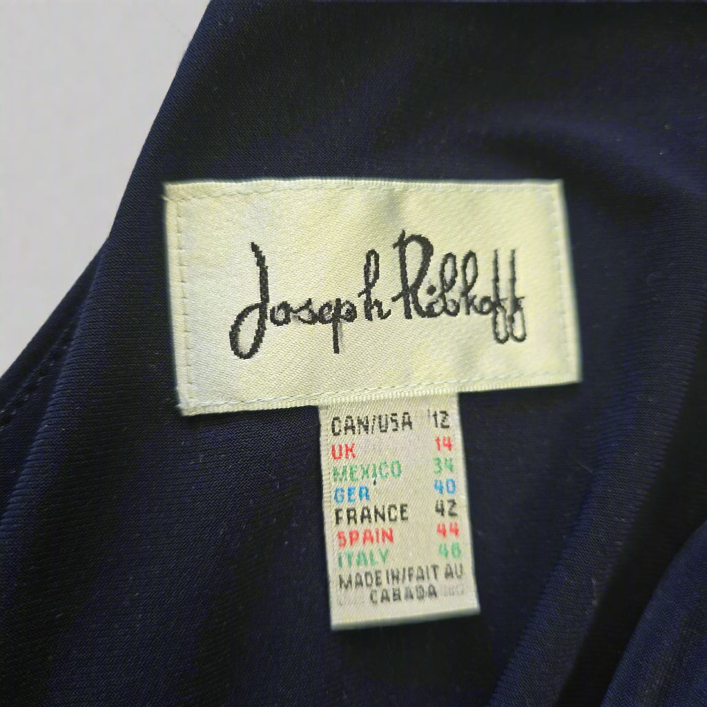 Close-up of a clothing label on a dark fabric background