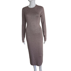 Plum coloured dress with silver details on a light background