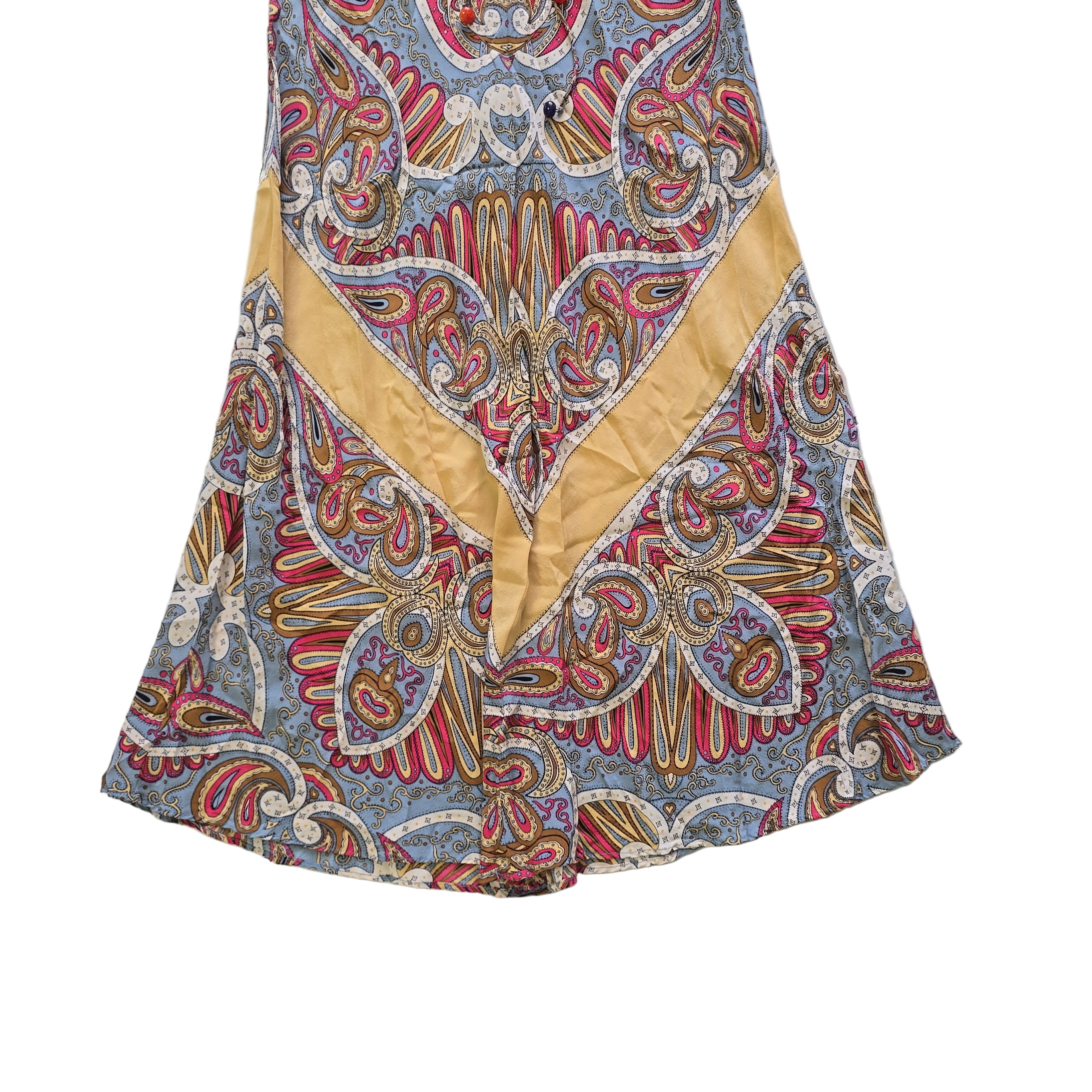 Colorful paisley-patterned fabric on a tiled floor