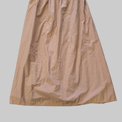 Brown skirt on a tiled floor